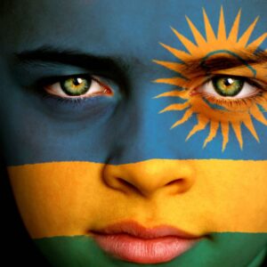 boy with Rwandan flag painted on his face